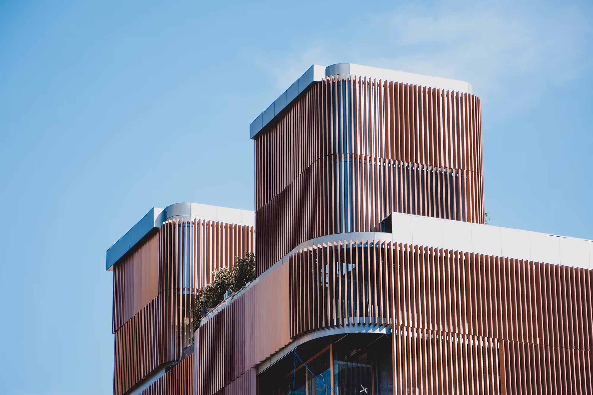 Building with innovative design, featuring clean lines and smooth geometric shapes.